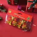 Packaged gold Christmas bells with dimensions and 28g weight info for tree decor. - Gold Angel Bell
