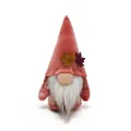 Detailed view of a fall harvest gnome with maple leaf accents and velvet hat. - Brick Red