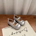 Close-up of silver mesh children's shoes with crystal-beaded Mary Jane straps - 22 / Silver