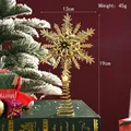 Golden electroplated snowflake Christmas tree topper with hollow design and spring base - 13x19cm