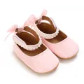 Detail view of pink PU leather baby princess shoes with elegant pearl lace and ribbon bows - Inner Length 11cm / Pink