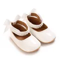 Close-up of white infant PU princess shoes featuring pearl straps and decorative bows - Inner Length 11cm / White