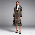 Full body view of women's ornate black trench coat featuring gold beadwork details - S / Tops / Gold