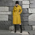 Elegant long mustard yellow double-breasted trench coat with a waist belt for women. - XS / Yellow