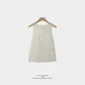 Elegant sleeveless top with shimmering silver sequins presented on a wooden hanger - S / Tops / Apricot