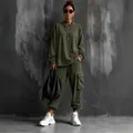 Detail view of women's olive green oversized top and cargo pants street style set - S / Top And Bottom / Long Sleeve Military Green