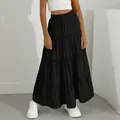Detail view of a black tiered maxi skirt with elastic high waist for casual summer wear - XS / Bottoms / Black