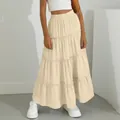 Detail of the elegant cream tiered maxi skirt showing the ruffled layers and fit - XS / Bottoms / Khaki