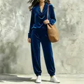 Full body view of a cobalt blue velvet lounge set with cowl neck and joggers. - Sapphire Blue