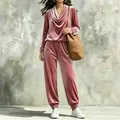 Close-up detail of the elegant rose pink velvet cowl neck top and jogger pants set - S / Top And Bottom / Pink