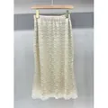 Eleganter beiger Pailletten-Midirock mit aufwendigem Wellenmuster und Wellensaum - M / Unterteile / Aprikose
