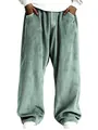 Gros plan de la texture velours côtelé vert sauge d'un pantalon rétro homme. - Vert clair