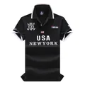 Detail view of the embroidered "USA NEW YORK" logo on a black cotton Polo shirt. - 6XL / Tops / Black