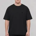 Detailed view of an oversized black washed cotton T-shirt with a subtle chest logo - S / Tops / Black