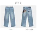 Vista dettagliata anteriore e posteriore dei jeans VESCARTES azzurri a gamba larga ricamati - XS / Pantaloni e gonne / Angelo Blu