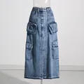 High-waisted cargo denim skirt in wash blue with utility pockets and front slit - S / Bottoms / Blue