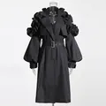 Elegant black mid-length trench coat featuring dramatic ruffle sleeves and a matching waist belt - S / Tops / Black
