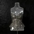 Detailed view of an elegant French style black lace peplum corset top on mannequin - S / Tops