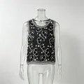 Detailed view of heavy beadwork and floral patterns on black sleeveless tank top - S / Tops / Black and White