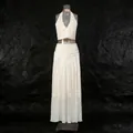 Detail of French white two-piece set featuring halter top and pleated skirt on black rock backdrop - S / Top And Bottom / Apricot