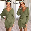 Close-up detail of the green ribbed knit wrap dress featuring a stylish waist tie - S / Dresses / Green