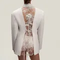 Elegant white fitted blazer featuring intricate floral lace back and rose detail - S / Tops / White