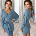 Detailed view of an elegant dusty blue V-neck ribbed knit bodycon dress with waist tie. - S / Dresses / Light Blue
