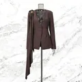Close-up detail of a brown deep V-neck blazer featuring an asymmetric drape accessory - S / Tops / Brown
