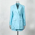 Detailed view of light blue suede-textured double-breasted blazer and shorts set. - S / Top And Bottom / Blue
