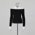 Front view of elegant fake two-piece long sleeve top combining black knit and white shirt - One Size / Tops / Black and White