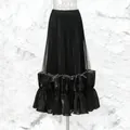Elegante gonna lunga nera a pieghe con orlo a balze e design in rete di tulle a strati. - Taglia M / Pantaloni e gonne / Nero