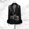 Close-up detail of luxurious black blazer featuring intricate rhinestone patterns and fur cuffs - M / Tops / Black
