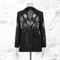 Detailed view of women's black blazer featuring vibrant firework sequin embroidery design - M / Tops / Black