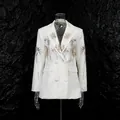 Detail showing sequined firework patterns on a white V-neck fashion blazer - M / Tops / White