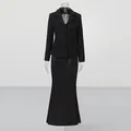 Elegant black tweed blazer and long fishtail skirt two-piece set on mannequin display. - S / Top And Bottom / Black