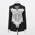 Detailed view of women's slim fit blazer with white lace corset patchwork design - S / Tops / Black