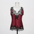 Detailed view of wine red silk camisole featuring delicate black eyelash lace trim. - S / Tops / Burgundy