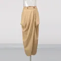 Close-up view of a professional khaki wrap-around pleated midi skirt with button waist detail. - S / Bottoms / Khaki