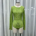 Sexy sheer lime green floral lace long sleeve bodysuit on a mannequin for women - S / Butterfly Print Style (Top) / Green