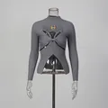 Detail of grey ribbed knit sweater with twisted cut-out design and gold eye embellishment - S / Tops / Gray