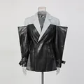 Blazer moderno de retazos de cuero con mangas esculturales de gran tamaño y diseño minimalista - S / Tops / Negro