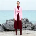 Detailed close-up of a pink blazer featuring a large 3D flower and elegant slim-waist design. - S / Tops / Pink