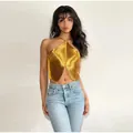 Detail showing metallic golden fringe halter top with irregular fishbone hem design - S / Tops / Gold