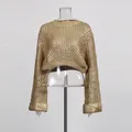 Macro view showing the intricate gold chunky knit pattern and metallic finish of the sweater - One Size / Tops / Brown