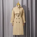 Elegant khaki double-breasted trench coat for women featuring a waist belt and epaulettes - XS / Tops / Gold Brown