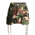 Close-up of stylish camouflage A-line cargo mini skirt featuring large zip pockets. - S / Bottoms / Camouflage