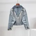 Oversized light blue denim jacket featuring a V-shaped fringe design on the back. - S / Tops / Light Blue