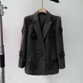 Elegant black oversized blazer for women with textured 3D floral decorations on hanger - S / Tops / Black