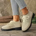 Close-up of stylish women's breathable fly-knit walking shoes with thick black soles - 36 / Off White
