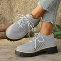 Close-up of grey breathable fly-knit platform casual sneakers with thick soles for women. - 36 / Gray